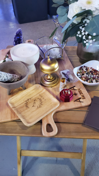 Mayan wedding altar table with candle, flowers, crystal, and ceremonial tools