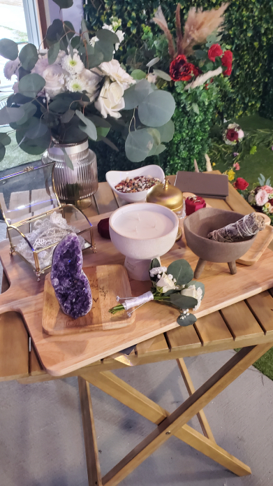 Full Mayan wedding altar setup with flowers, sage, crystal, and ceremonial objects